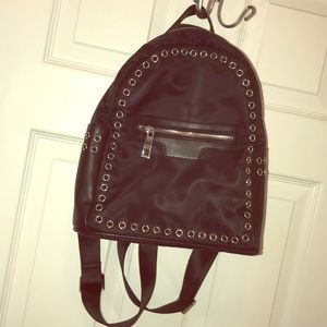 Black and silver studded backpack